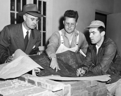 Men Looking At Blueprints