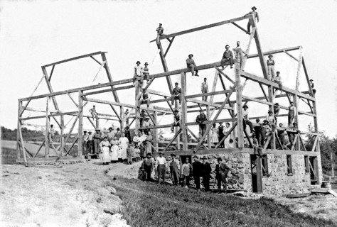 A barn raising with all the neighbors