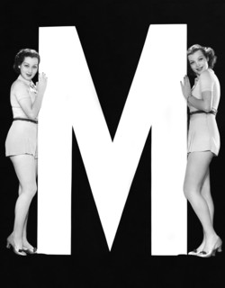 The Letter "M"  And Two Women