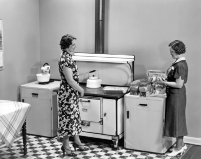 Beaver Dam, Wisconsin:  1937.
Two women admiring loaves of freshly baked bread.