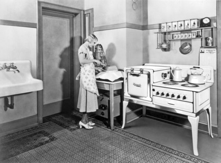 Woman Cutting A Homemade Cake