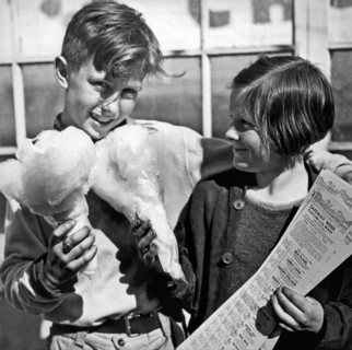 San Francisco, California:  March, 1937.
Two children eating cotton candy  take advantage of