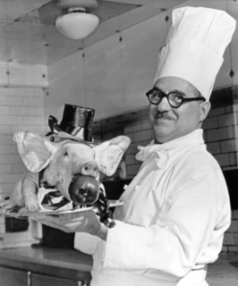 London, England:  February 28, 1961.
A roast pig, complete with top hat, tie, and tails, to be