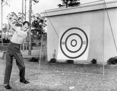 A Man Practices Golf