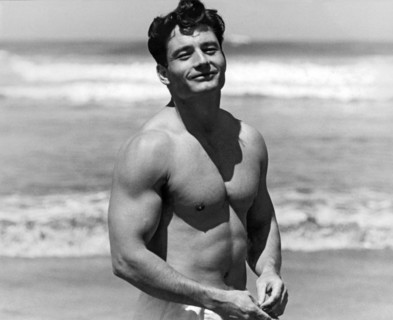 Body Builder At The Beach.
