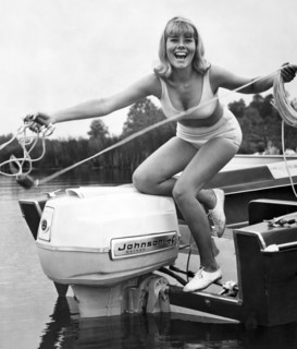 Woman Throws A Line From A Boat