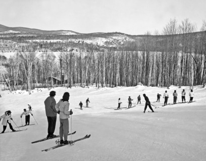Two Skiers Pause On A Slope