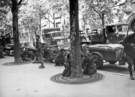 Paris, France:   August 28, 1944.
French soldiers of the 2nd Amored Division scan the rooftops of