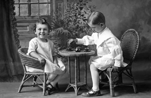 Boy Pours Sister A Cup Of Tea