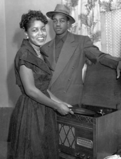 Stylish Couple Playing Records