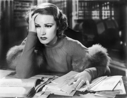 Forlorn Woman At Desk