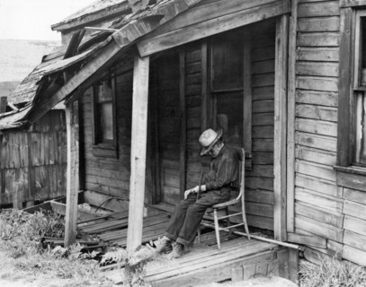 Elderly Man Doses On His Porch
