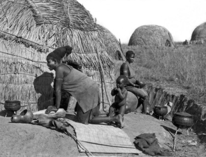 Native Woman Kneading Bread