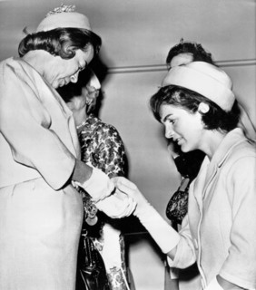 Jackie Inspects Gold Bracelet