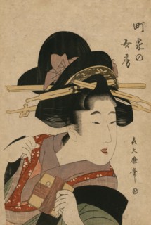Woman holds silk heddle
