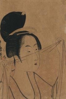 Woman looks thru gossamer silk fabric