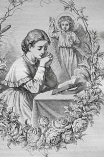 Praying child with an angel