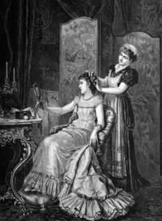 Maid combing a lady