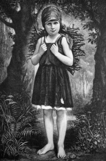 Barefoot girl gathering wood
