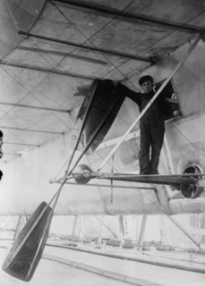 Man posing next to propeller of Wellman air ship, Spitzbergen