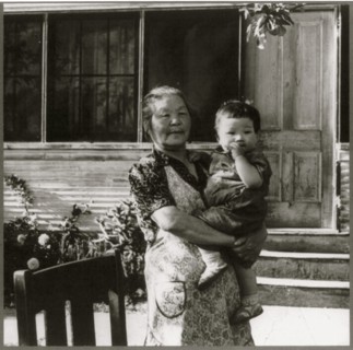 Grandmother Hold Baby in evacuation to Manzanar 1942