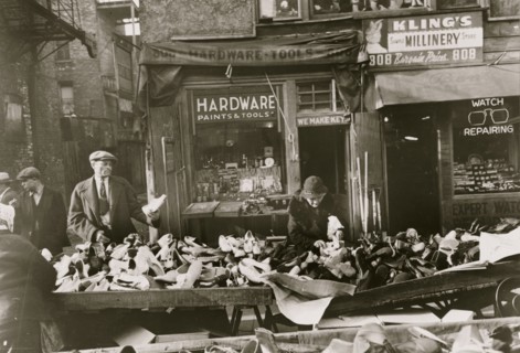 People shopping for shoes at shop on Maxwell Street, Chicago, Illinois 1941
