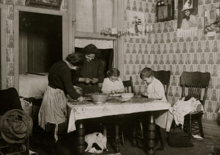 Italian Family picks nuts in their tenement apartment 1911
