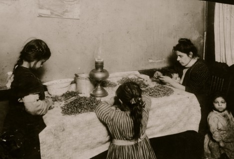 Picking Nuts in squalor and poverty  in a basement tenement apartment 1911