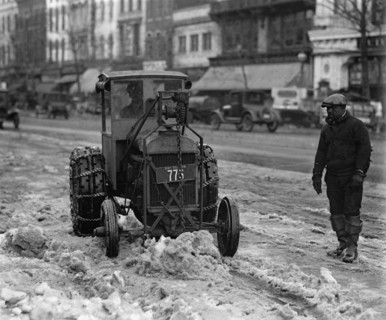 A Ford Tractor cleans snow on DC Street 1924