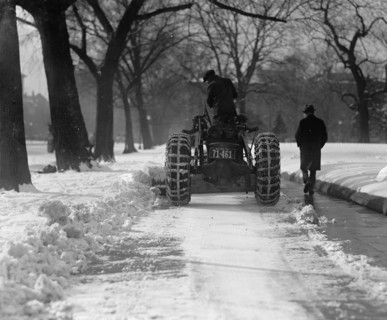 A Ford Tractor cleans snow on DC Street 1924