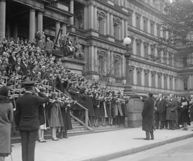 A hundred Massed Violins on the Steps of the Navy Building in Washington, DC play the Star Spangled Banner to the saluting of officials 1917