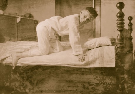 A Young Boy Climbs into Bed 1924