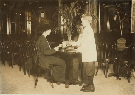 A young table boy in Newsome's ice cream parlor. 1914