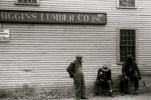 African American sit by the side of  Lumberyard in Provincetown, Mass. 1940