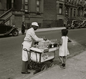 African American Vendor Sells water ice in the city on  hot day to a young black girl 1940
