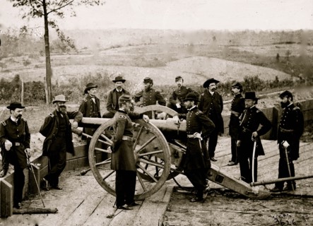 Atlanta, Ga. Gen. William T. Sherman, leaning on breach of gun, and staff at Federal Fort No. 7 1864