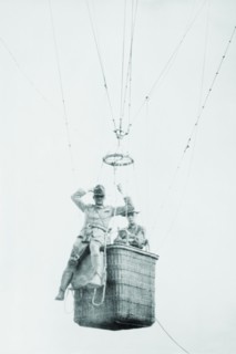 Balloon jump by a parachutist hanging from a basket suspended by it but out of the image.