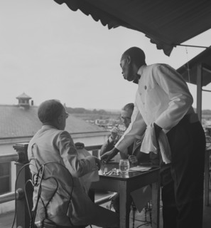 Black waiter in Hertzog's, seafood restaurant along the waterfront. Washington, D.C. 1941
