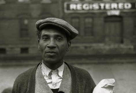 Black waiting for freight train to leave Dubuque, Iowa 1940