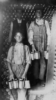 Boys Working in a Cannery, Indianapolis, Unloading freight cars full of new tomato cans 1908