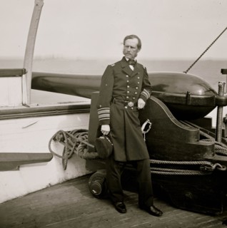 Charleston Harbor, South Carolina. Rear Adm. John A. Dahlgren standing by a Dahlgren gun on deck of U.S.S. PAWNEE 1864