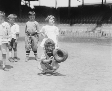 Pint sized Catcher awaits a pitch in Children's Baseball Game 1921