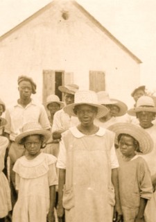 Eliz Austin and children with Cleveland Simmons, Old Bight, Cat Island 1935