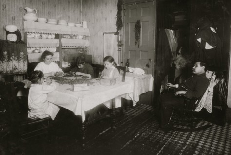 Italian Family picks nuts in their tenement apartment 1911