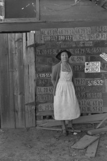Farm woman beside her barn door 1938