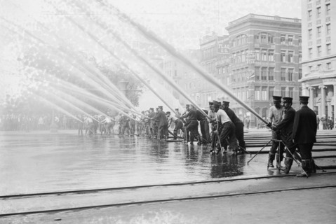 Fireman testing high-pressure hoses, New York