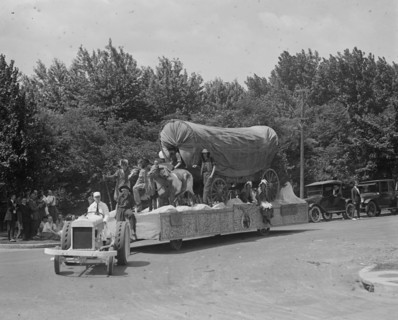 Float in the Shriner's Parade has a Conestoga Wagon with Pioneers 1923
