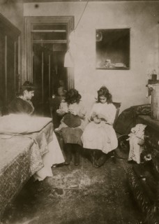Italian Family manufactures scarf's, slippers and muffs in their tenement apartment 1911