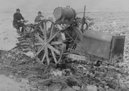 German Designed Huge Tractor digs for unearths potatoes.