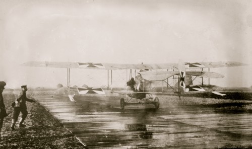 German Military Aviators in their planes on the tarmac